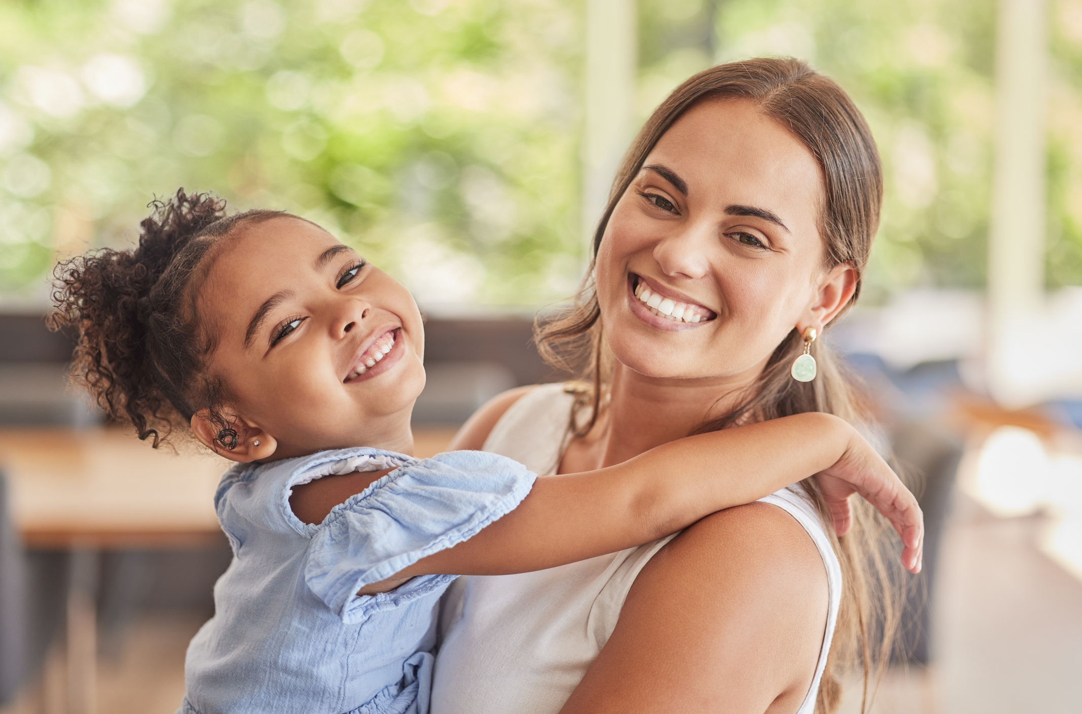 Therapist and child laughing together during an ABA therapy session in Houston