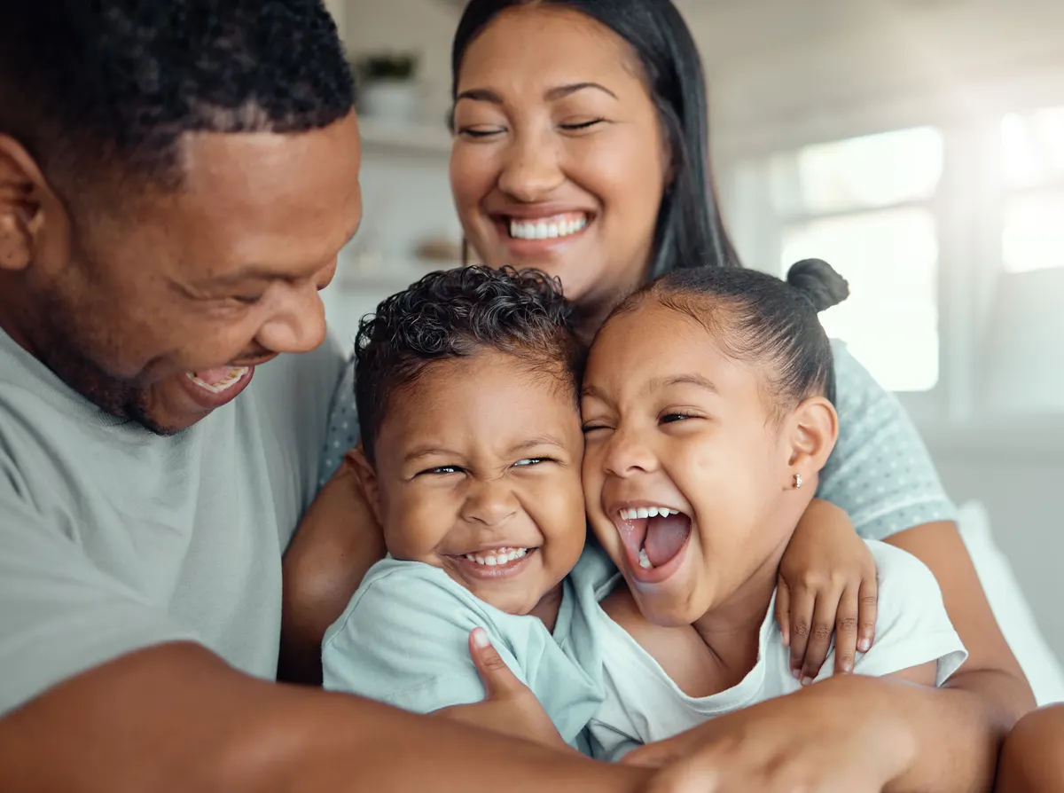 Parent and child smiling together