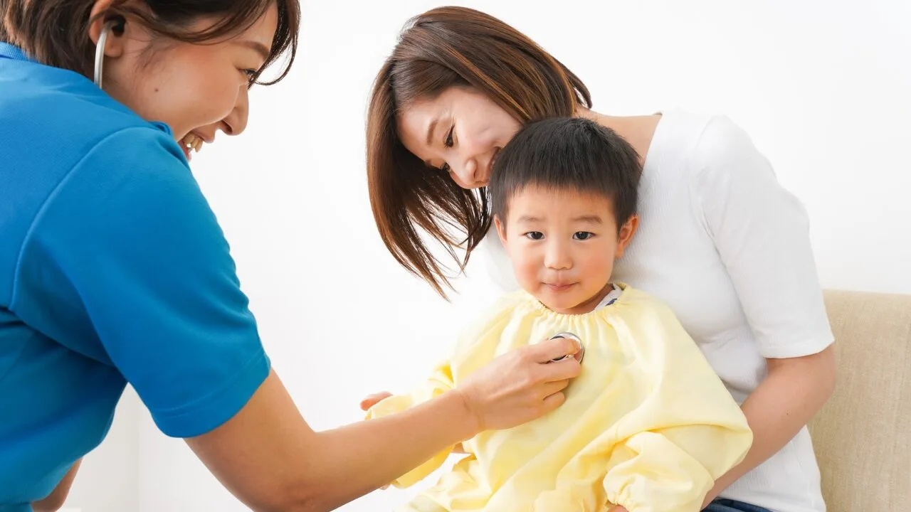 Boy being checked by doctor