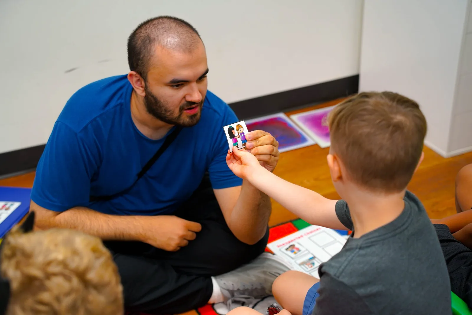 Father showing child flashcards