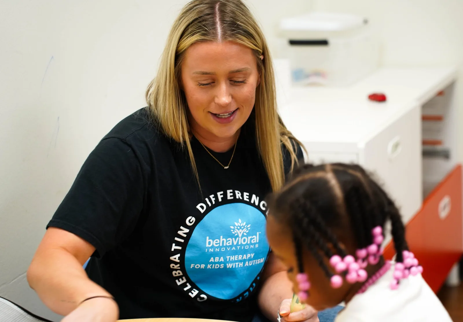 Therapist teaching young girl