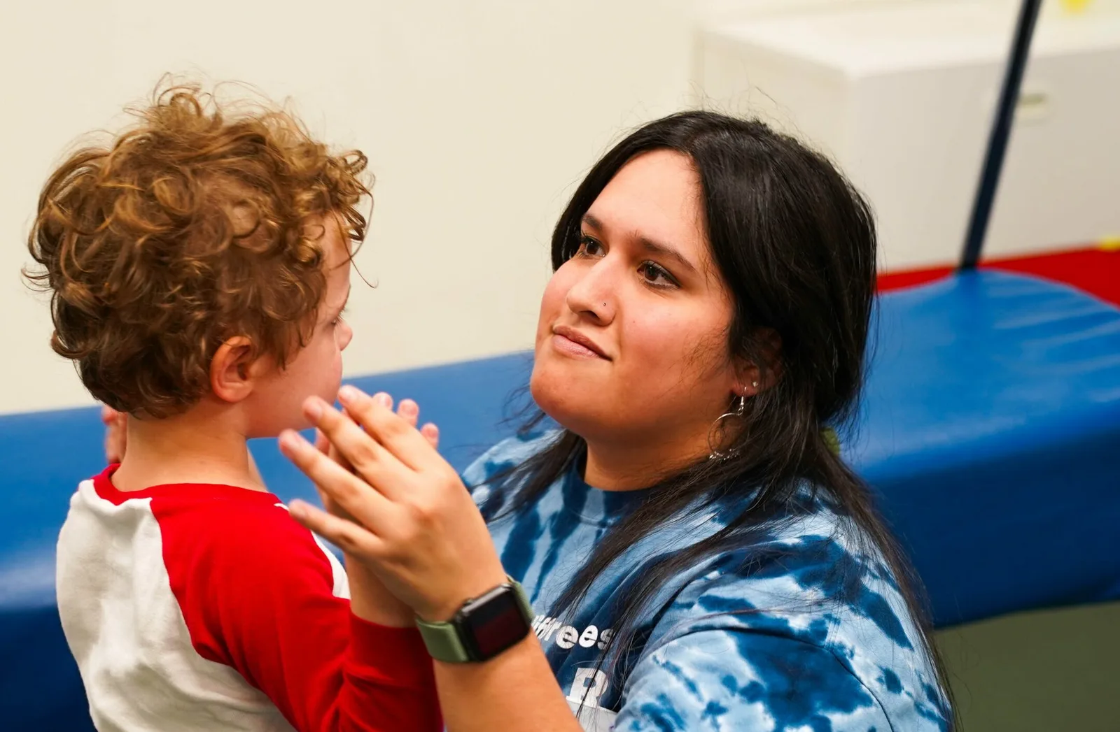 Therapist observing young boy