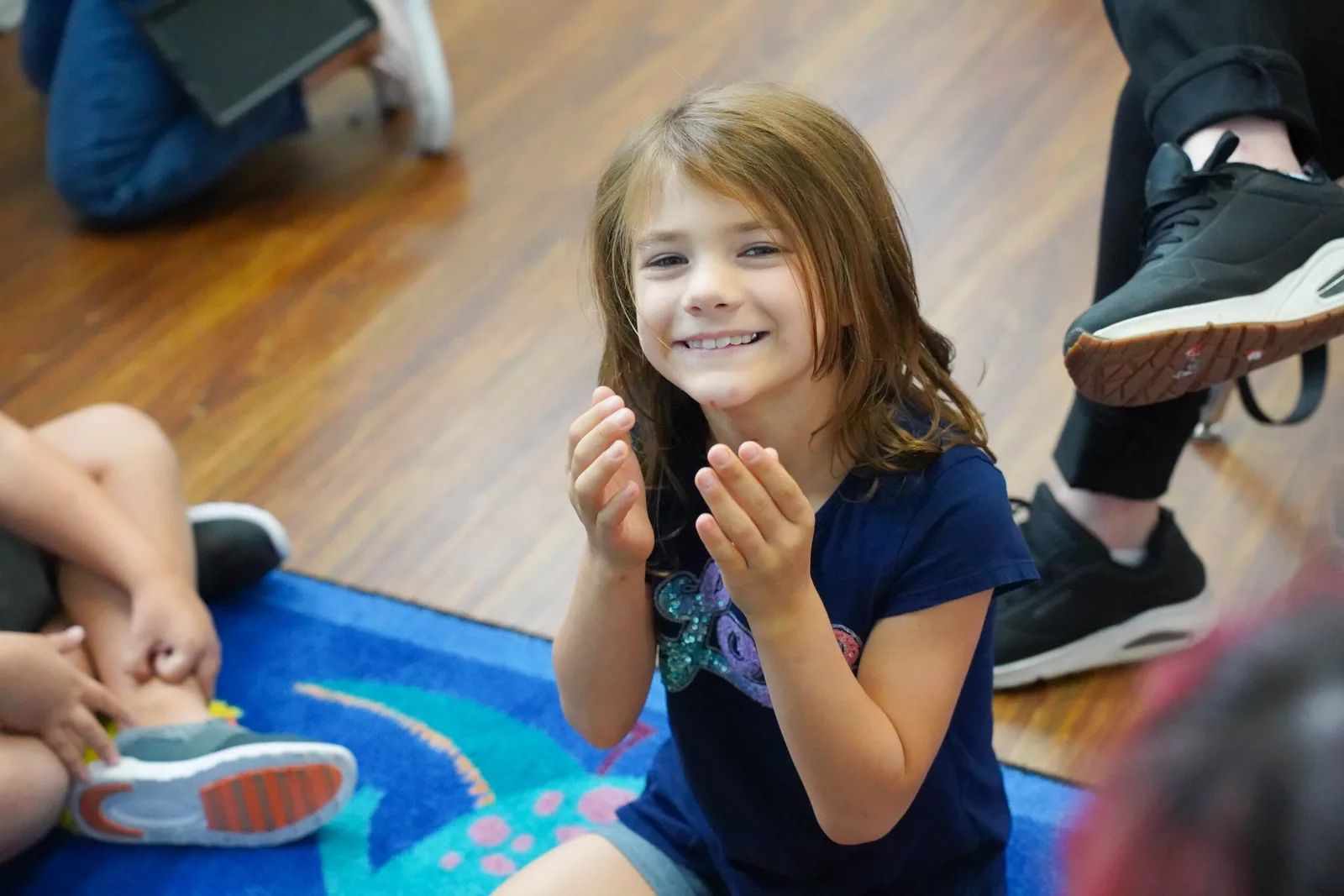 girl smiling and playing