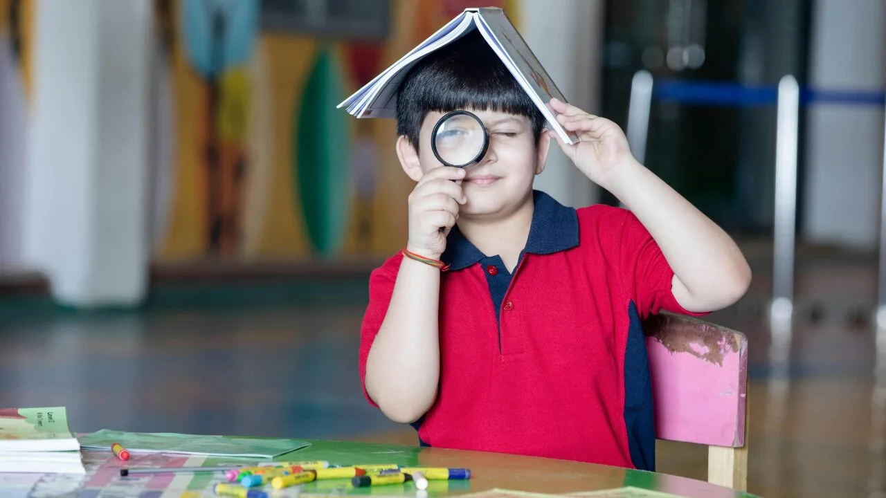 A child plays in a classroom.