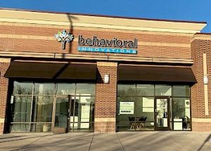 a brick building with a sign that says behavioral innovations on it