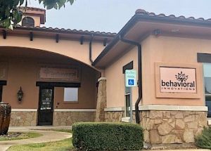 a building with a sign on the side that says behavioral innovations