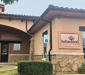 a building with a sign on the side that says behavioral innovations
