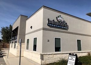 a building with a sign that says `` behavioral innovations '' on it .
