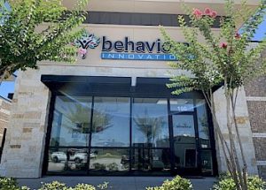 the front of a building with a sign that says behavior innovation
