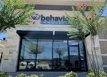 the front of a building with a sign that says behavior innovation
