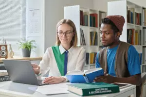 teacher have a on-on-one session with college student