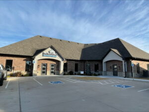 a brick building with a handicapped parking space in front of it