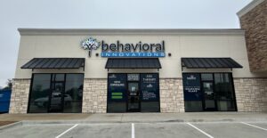 a behavioral innovations building with a sign that says aba therapy